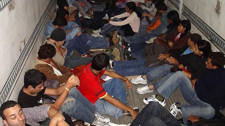 Photo: Transporting new migrant workers to Doha, Qatar. Source: tellmemoreblogger.com