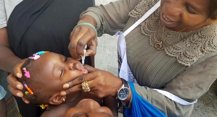 Photo: A child being given polio oral vaccination. Credit: WHO Regional Office for Africa
