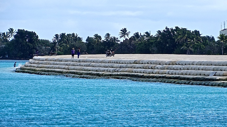 Photo: The newly built TCAP barrier against rising sea levels using sand dredged from the lagoon off Funafuti. Credit: Kalinga Seneviratne.