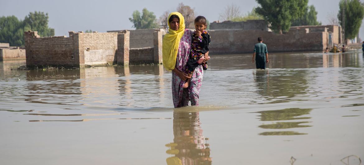 mother-and-child-in-a-flooded-area.jpg